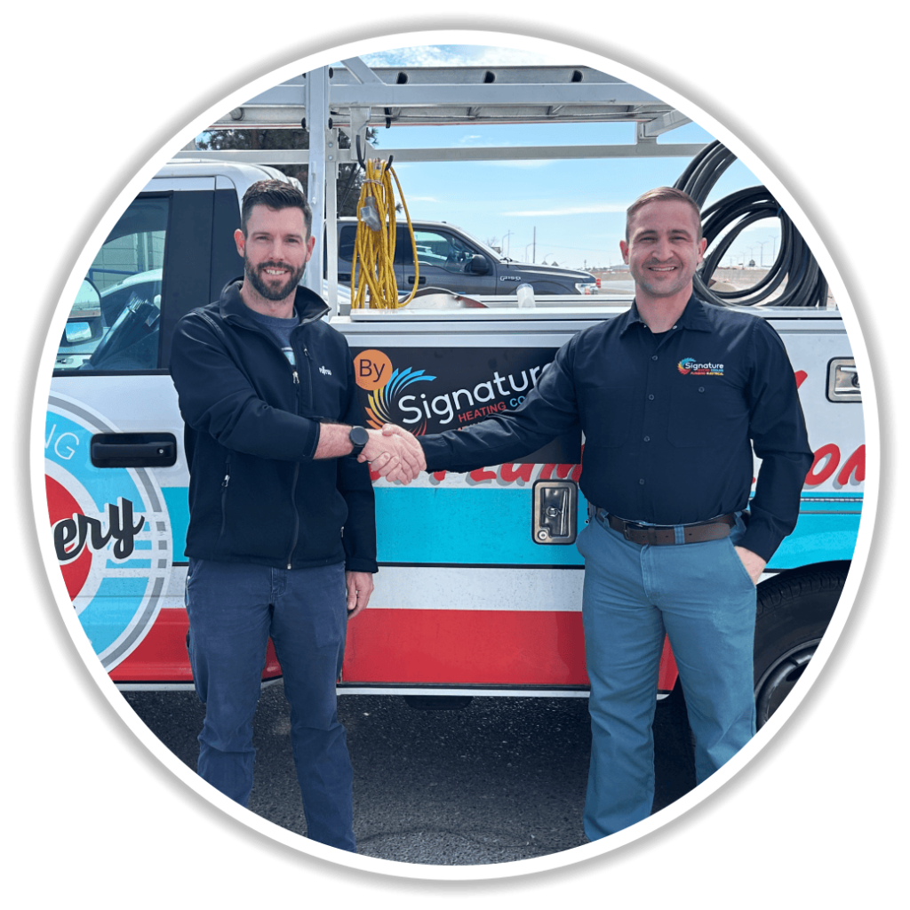 Owner of JP Plumbery, Jonathan P. Schreiner, shaking hands with GM of Signature heating Cooling Plumbing & Electrical
