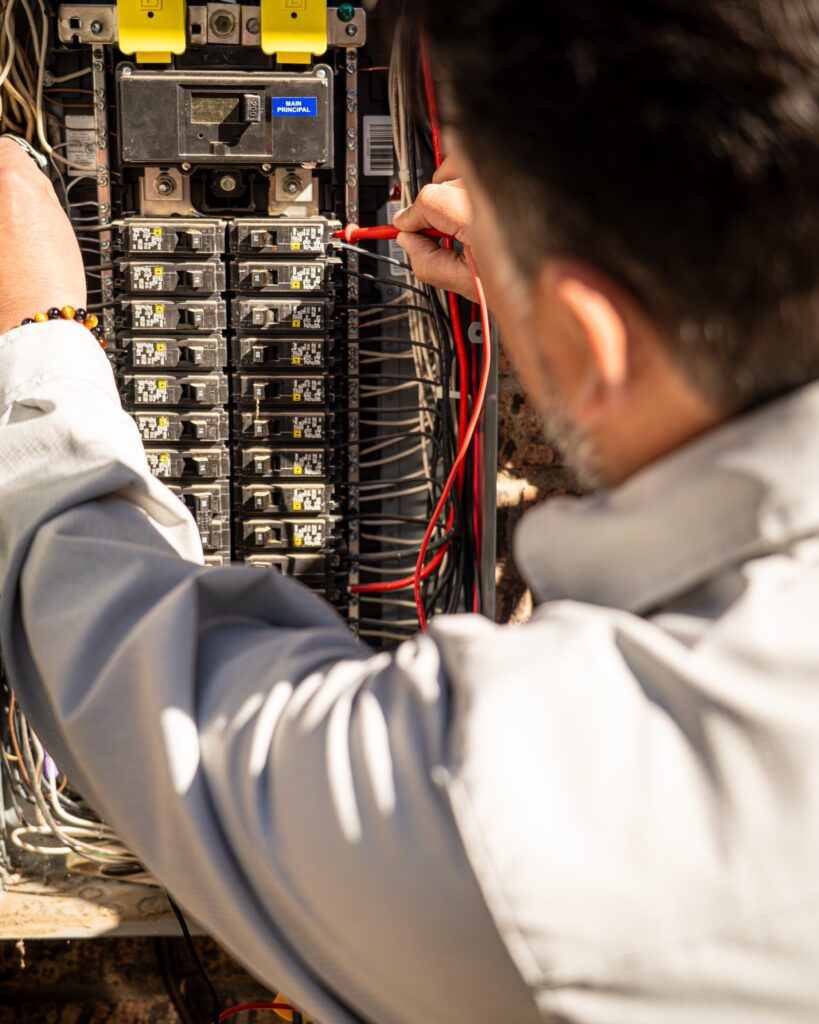 Signature Electrician in Albuquerque checking an electrical panel